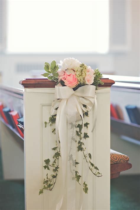 Small Bunches Of Roses Hydrangeas And Ivy Decorated The Pews Wedding