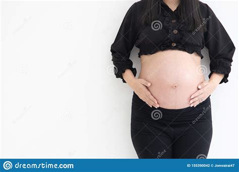 Concept Of Health Pregnancy Cropped Of Pregnant Woman Standing On