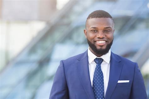 Premium Photo Confident Afro Businessman Smiling And Looking At