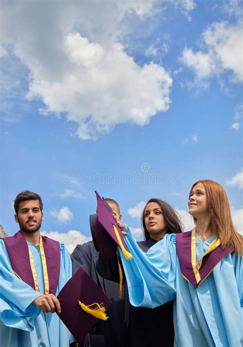 Group Of Students In Graduation Gowns And Caps Stock Photo Image Of