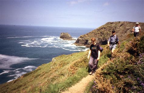 Walkers On The Cornish Coast Path Between Boscastle And Tintagel