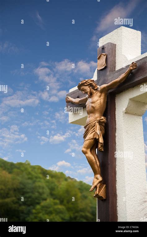 Statue Of Jesus On Cross With Blue Sky Stock Photo Alamy