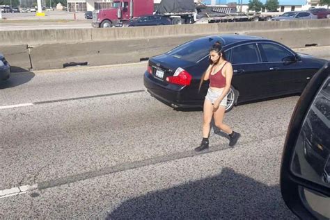 Watch Traffic Slows For Woman Walking Between Highway Lanes UPI Com