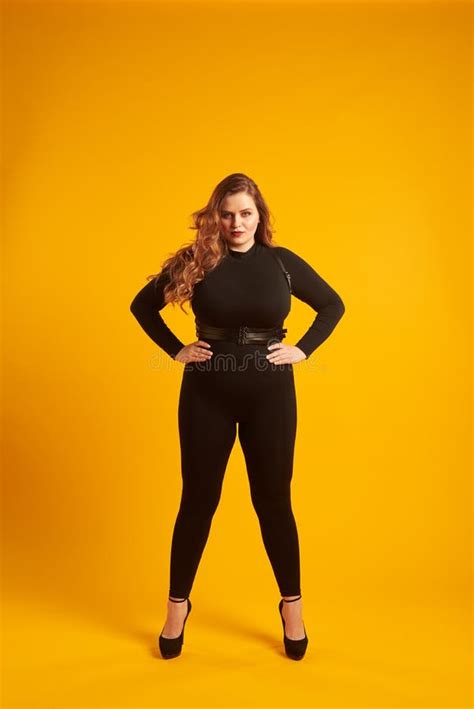 Curvy Girl In Tight Fitting Clothes Posing With Her Hands On Hip Stock Image Image Of Hair