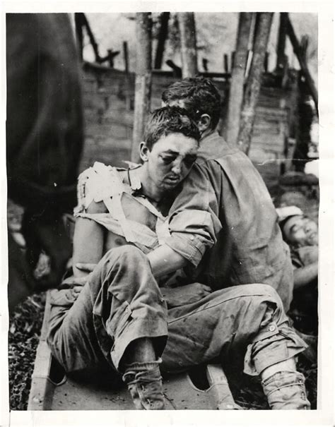 1944 Wounded Us Soldier Is Helped From Stretcher By Fellow Soldier