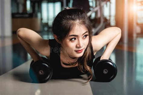 Muscular Woman Doing Push Ups On Dumbbells In Gym Stock Photo Image