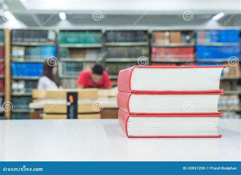 A Pile Of Books With Library On The Back Stock Image Image Of