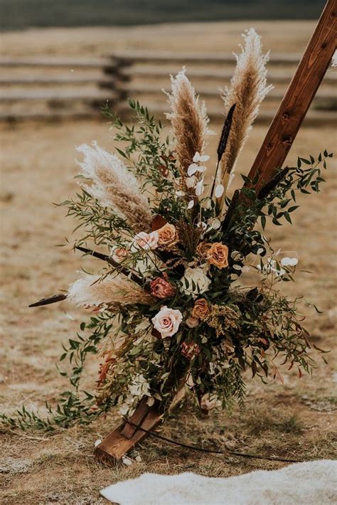 Boho Western Inspired Wedding Wedding Arch Flowers Fall Wedding