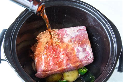 In a slow cooker, add the brisket, enough water to cover it and the spices from the spice packet or your own spices. Slow Cooker Corned Beef Brisket Recipe Beer