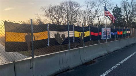 Flags Honoring First Responders Vandalized On Cape Cod Overpass