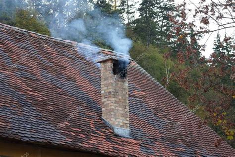 Smoke From The Chimney Of The Old House — Stock Photo © Bacho123456