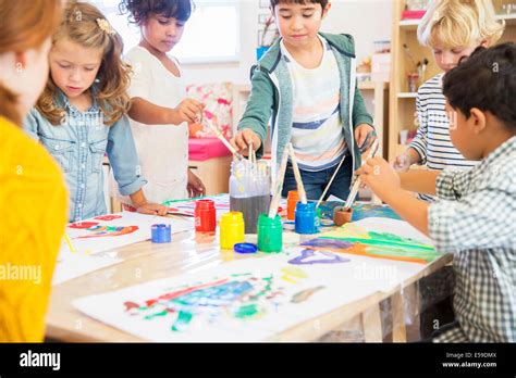 Teacher Student Painting In Classroom Hi Res Stock Photography And