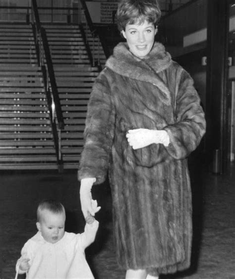 Julie Andrews Wearing A Full Length Fur Coat While Holding Daughter