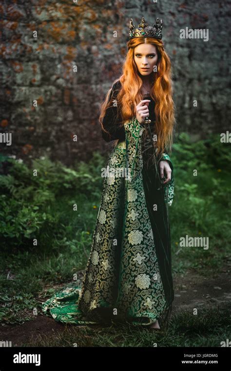 portrait   beautiful red haired woman  green medieval dress stock
