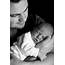Grayscale Photo Of Man Holding Baby · Free Stock