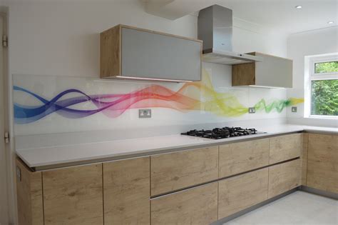A Kitchen With White Counter Tops And Wooden Cabinetry Painted Rainbow