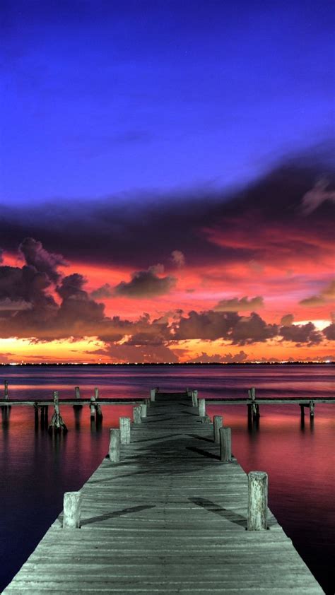 Download Wallpaper 720x1280 Sunset Landscape Sky Paint Pier Wooden
