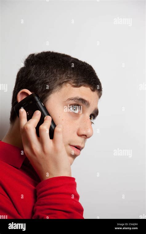 Teenage Boy Chatting On A Smartphone Stock Photo Alamy