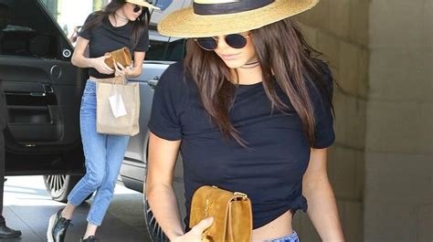 Kendall Jenner Flashes Her Toned Stomach In Midriff Baring T Shirt
