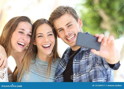 Three Happy Friends Taking Selfie Together In The Street Stock Image Image Of Group Girls
