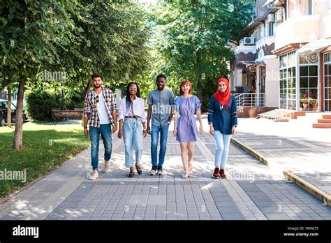 Multiracial Group Of Friends Walking In The Street Stock Photo Alamy