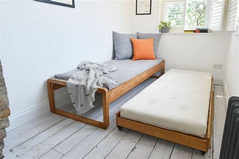 White bunk bed with navy bedding. Trundle bed open | Bunk bed designs, Bed design, Kids bunk ...