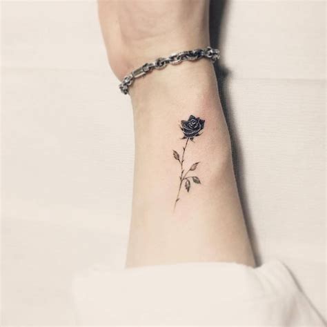 Black Rose Tattoo On The Inner Forearm