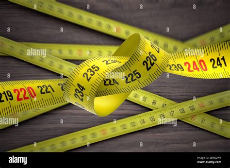 Tangled Yellow Tape Measure Stock Photo Alamy