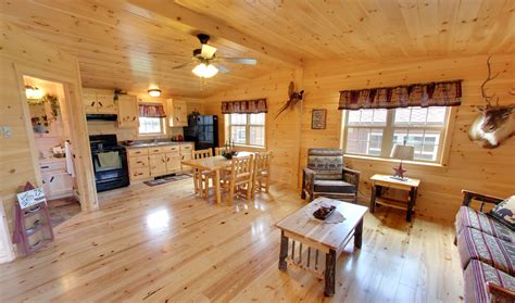 White Pine Living Room And Kitchen In Musketeer Cabin Cozy Cabins Llc
