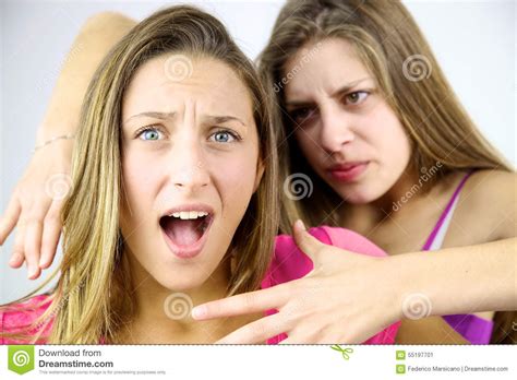Angry Girl Willing To Strangle Blond Screaming Friend Stock Image