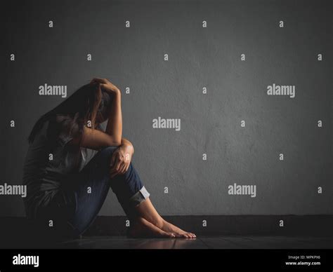 Sad Woman Hug Her Knee And Cry Sad Woman Sitting Alone In A Empty Room Stock Photo Alamy