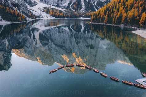Aerial View Of Boats Anchored Along The Lago Di Braies Lake Dolomites