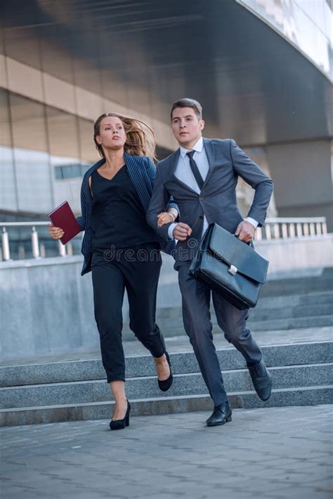 Two Young Employees In A Hurry Somewhere Stock Image Image Of Away