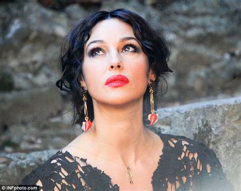 Monica Bellucci Flashes Her Cleavage As She Shoots New Dolce Gabbana