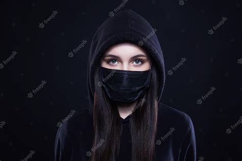 Premium Photo Young Woman In Mask And Hood Girl In Black Mask And Hoodie