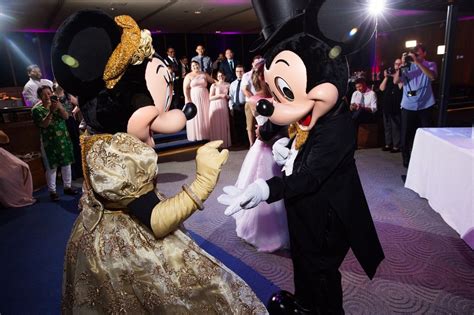 Minnie Mouse And Mickey Mouse Dancing As Special Guests At A Disney