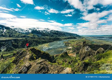 Hiker Man In Red Jacket Standing On Top Of Valahnukur Surrounded By