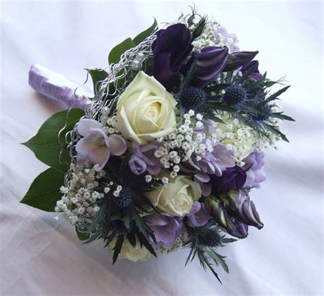Premium artificial wedding flowers that don't look cheap. RJ's Florist: Purple, lilac and ivory wedding flowers