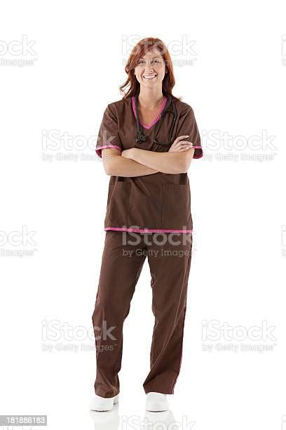 Female Nurse Smiling With Arms Crossed Stock Photo Download Image Now