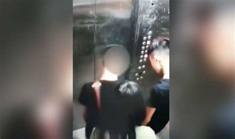 Bizarre Cctv Footage Chinese Men Urinate In Elevator While Woman Tries To Block Camera