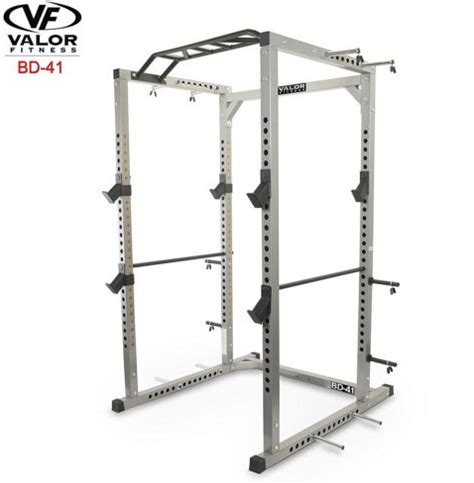 The Valor Power Cage Is Shown In Silver And Has Four Squat Racks On