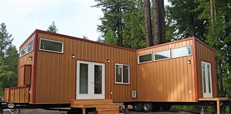 Two Tiny Houses On Wheels Permanently Joined Together To Make A Bigger
