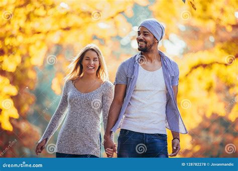 Mixed Couple Walking In The Autumn Park Stock Photo Image Of