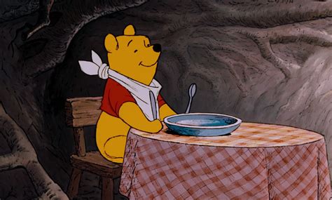 Winnie the Pooh is getting ready to eat some honey.jpg | Winnie the