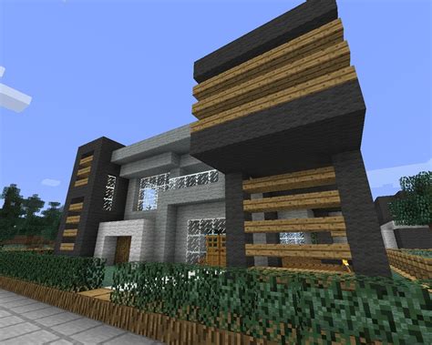 All the pain getting all that wood, stone, and even iron, always end. Modern House with some wood Minecraft Project