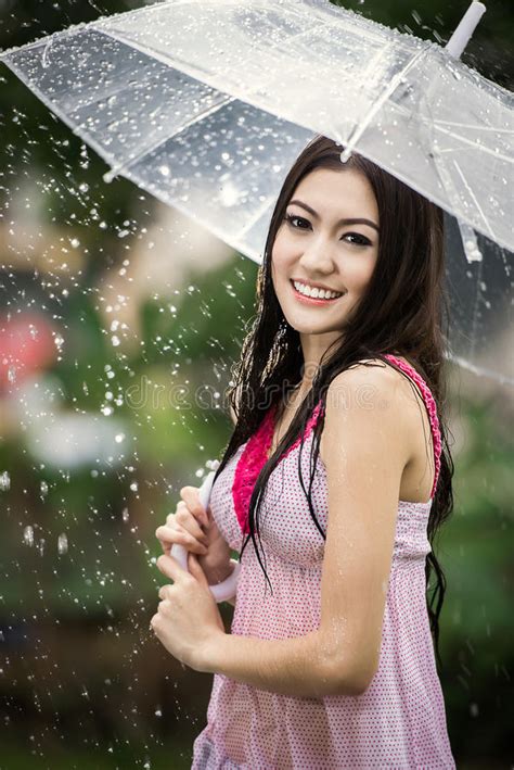 Beautiful Girl In The Rain With Transparent Umbrella Stock Image