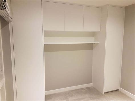 Overbed Fitted Wardrobes And Storage Units Bespoke Overhead Storage