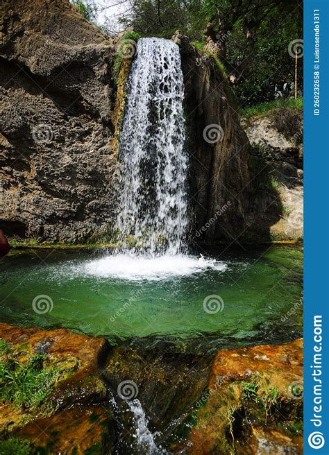 Jungle Waterfall Cascade In Tropical Rainforest With Rock And Turquoise