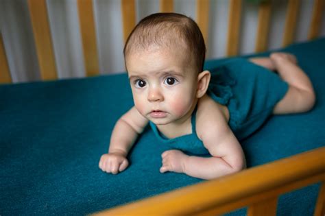 Cute Newborn Baby On A Blue Blanket Baby In His Bed Closeup Portrait Of