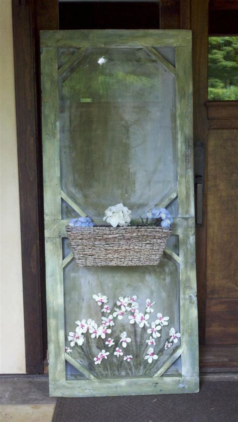 Use a roller to apply one coat of paint. old screen door / decorative with a planter box on the front